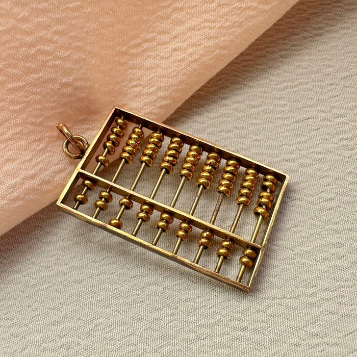 14k Articulated Abacus Charm
